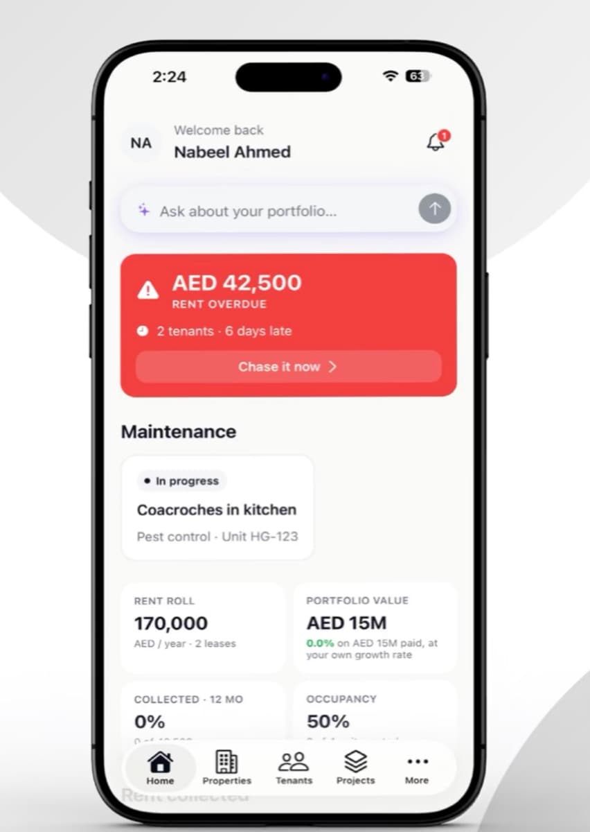 The OWNRS owner app showing the AI assistant prompt above portfolio stats.
